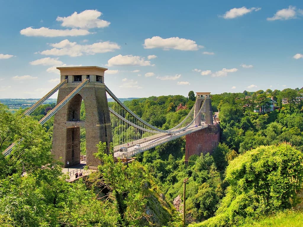 Clifton Suspension Bridge spanning Bristol’s green Avon Gorge, seen from Observatory Hill on a sunny day